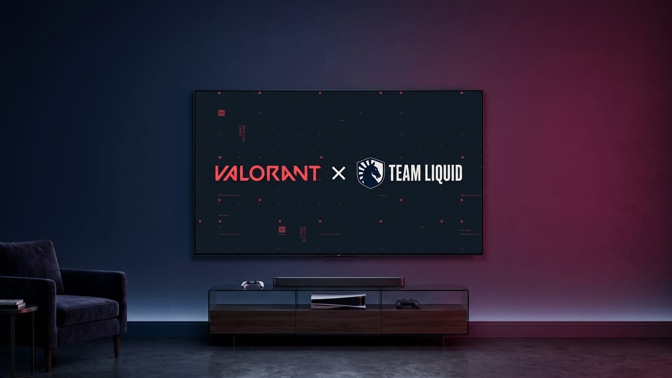 Telão com os logos de Valorant e Team Liquid em uma sala de estar com console e controles